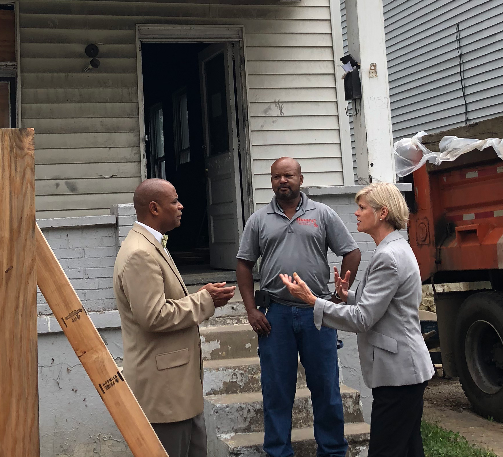 The HURC is rehabbing six vacant, severely blighted, single-family homes in Evanston, creating homeownership opportunities for low- to moderate-income individuals and families. Robert Killins, Jr., Director of Special Initiatives at the Greater Cincinnati Foundation, which provided a $1,000,000 impact investment to The Port for the rehab of foreclosed, vacant residential properties into homes ready for sale, and Laura Brunner, President and CEO of The Port, talk with Eric Hunn, Hunn's Construction, who is rehabbing 1650 Jonathan for the HURC.